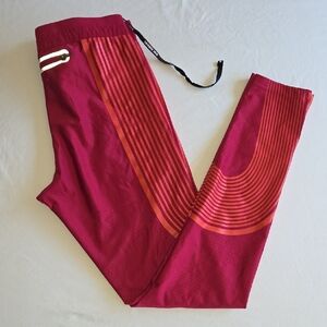 Nike Women's Deep Berry Leggings with Orange Stripe Accents